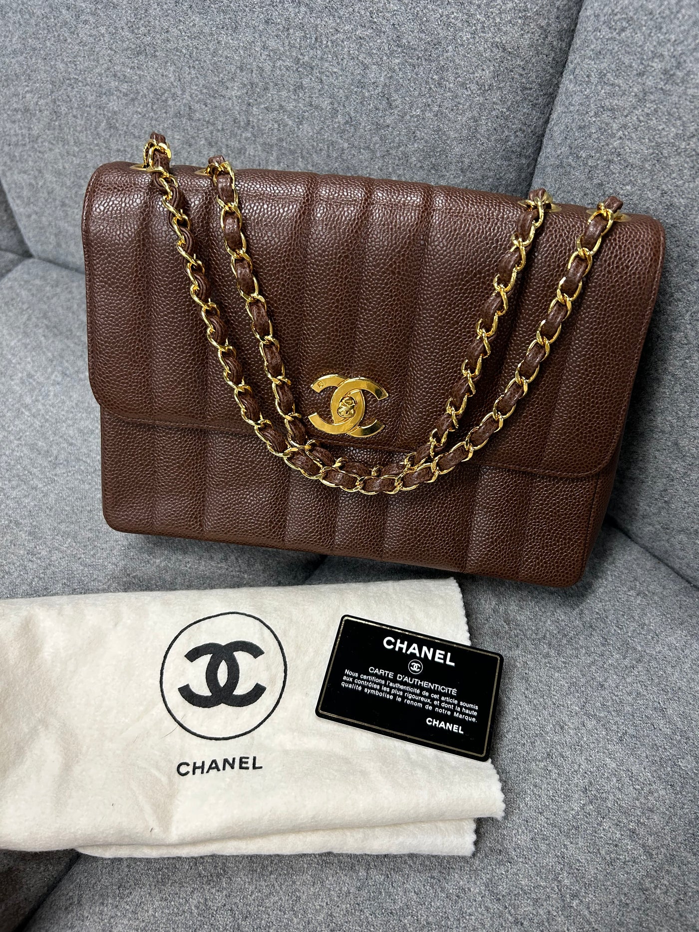 CHANEL mademoiselle vertical caviar brown 24ct gold hardware handbag