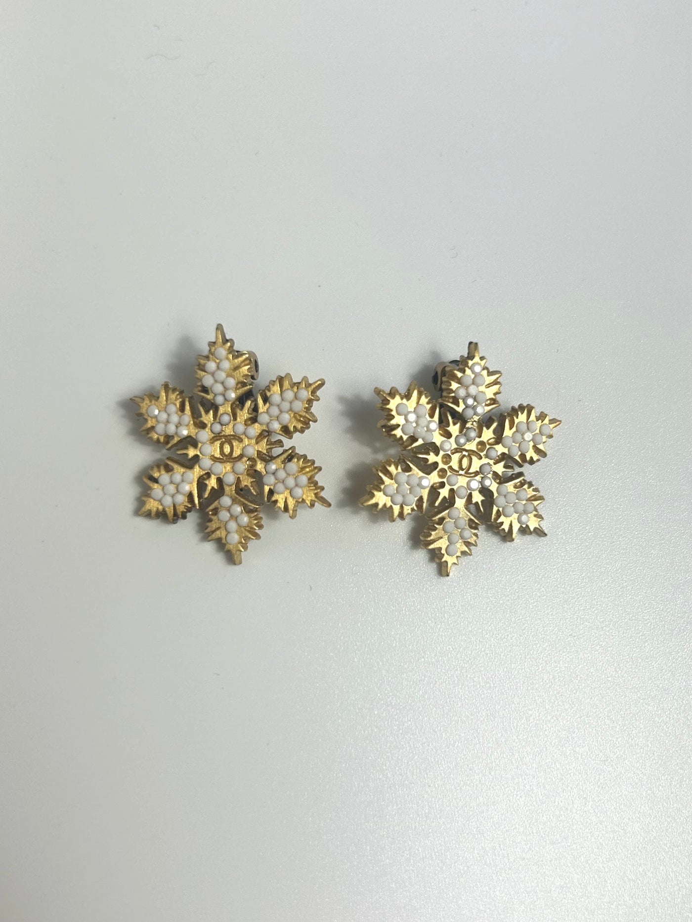 CHANEL snowflake clip on earrings