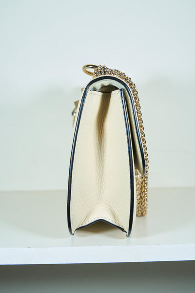 VALENTINO rockstud cream handbag with gold hardware