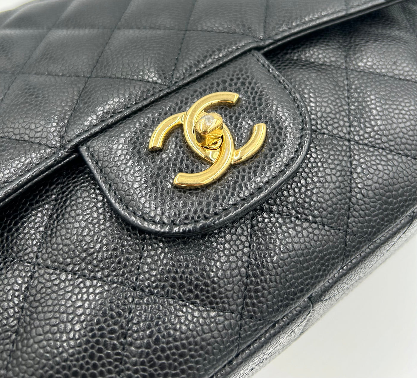 CHANEL Classic Jumbo Caviar single flap handbag with gold hardware