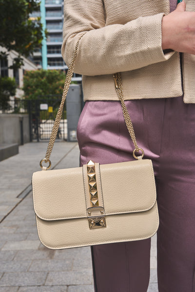 VALENTINO rockstud cream handbag with gold hardware