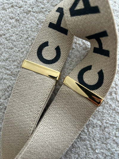 CHANEL VINTAGE SS 1994 Runway beige leather and fabric suspender