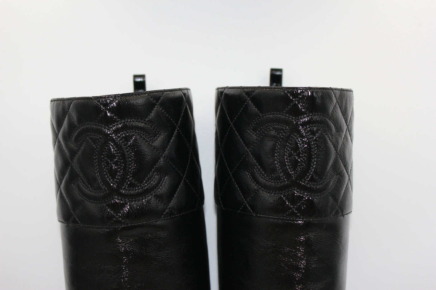 CHANEL black leather CC boots