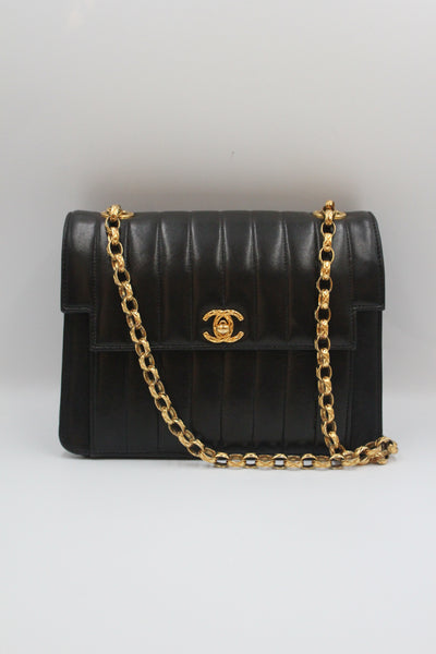 CHANEL rare black vertical handbag with 24 carat gold plated bijoux chain