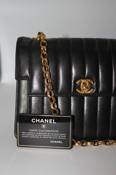 CHANEL rare black vertical handbag with 24 carat gold plated bijoux chain